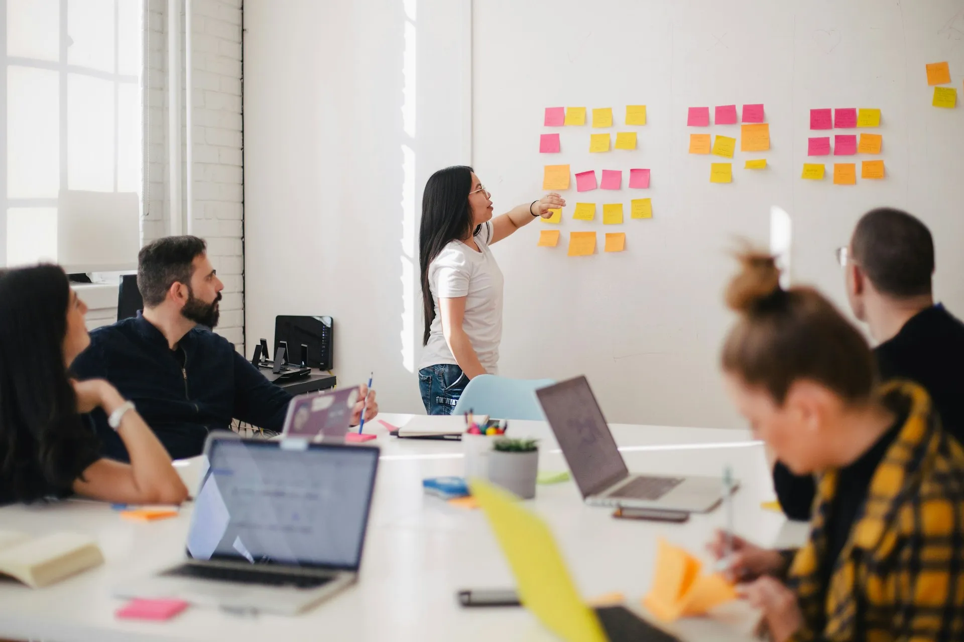 Planning session with sticky notes on a board